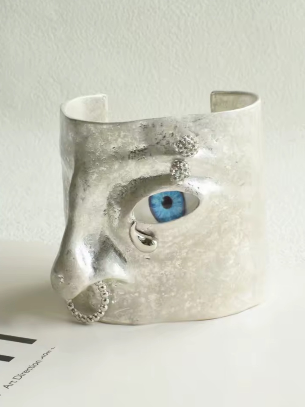 Silver Face Cuff Bracelet with Blue Eye Detail